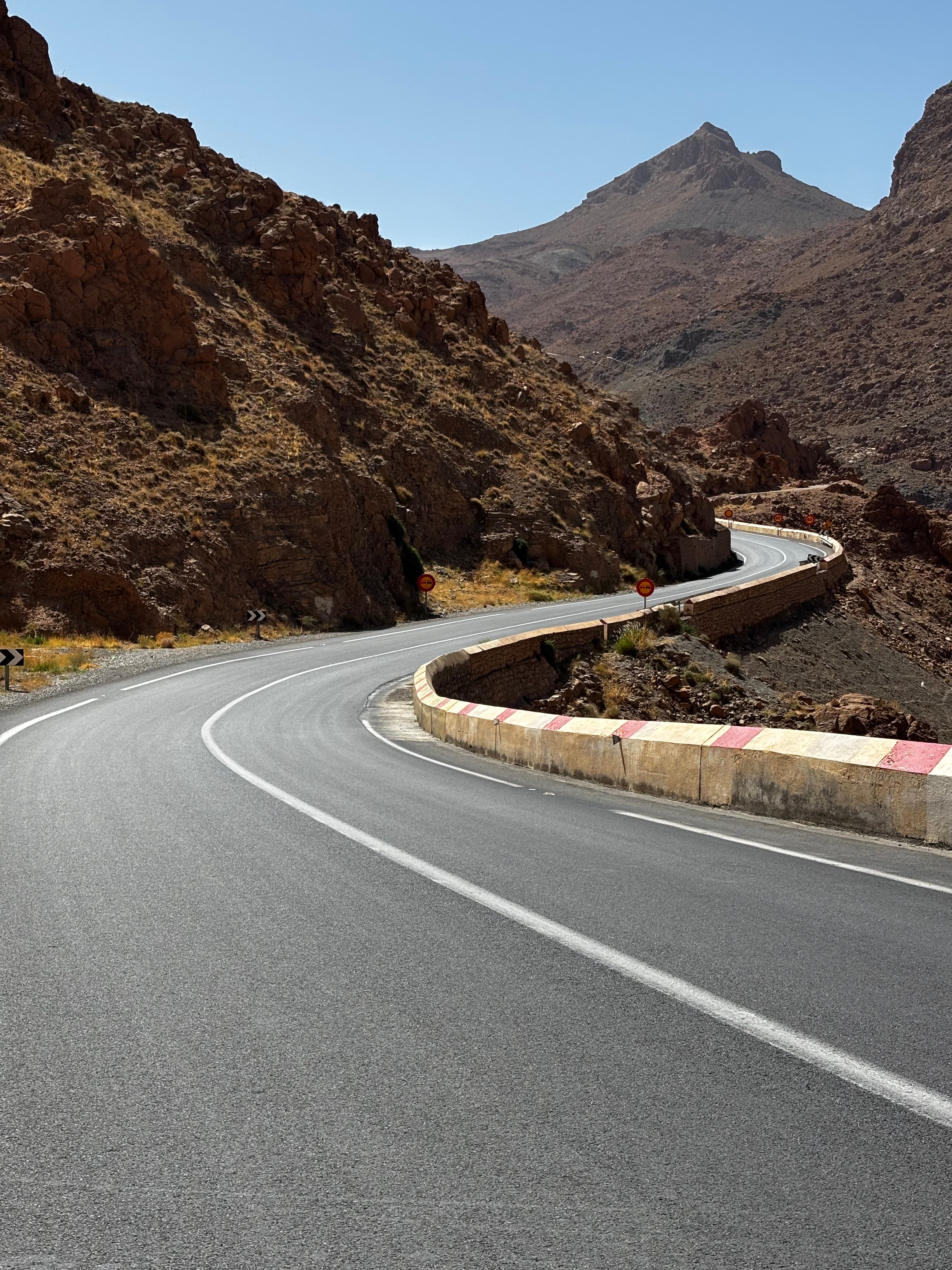 Winding mountain road through a rocky Moroccan pass