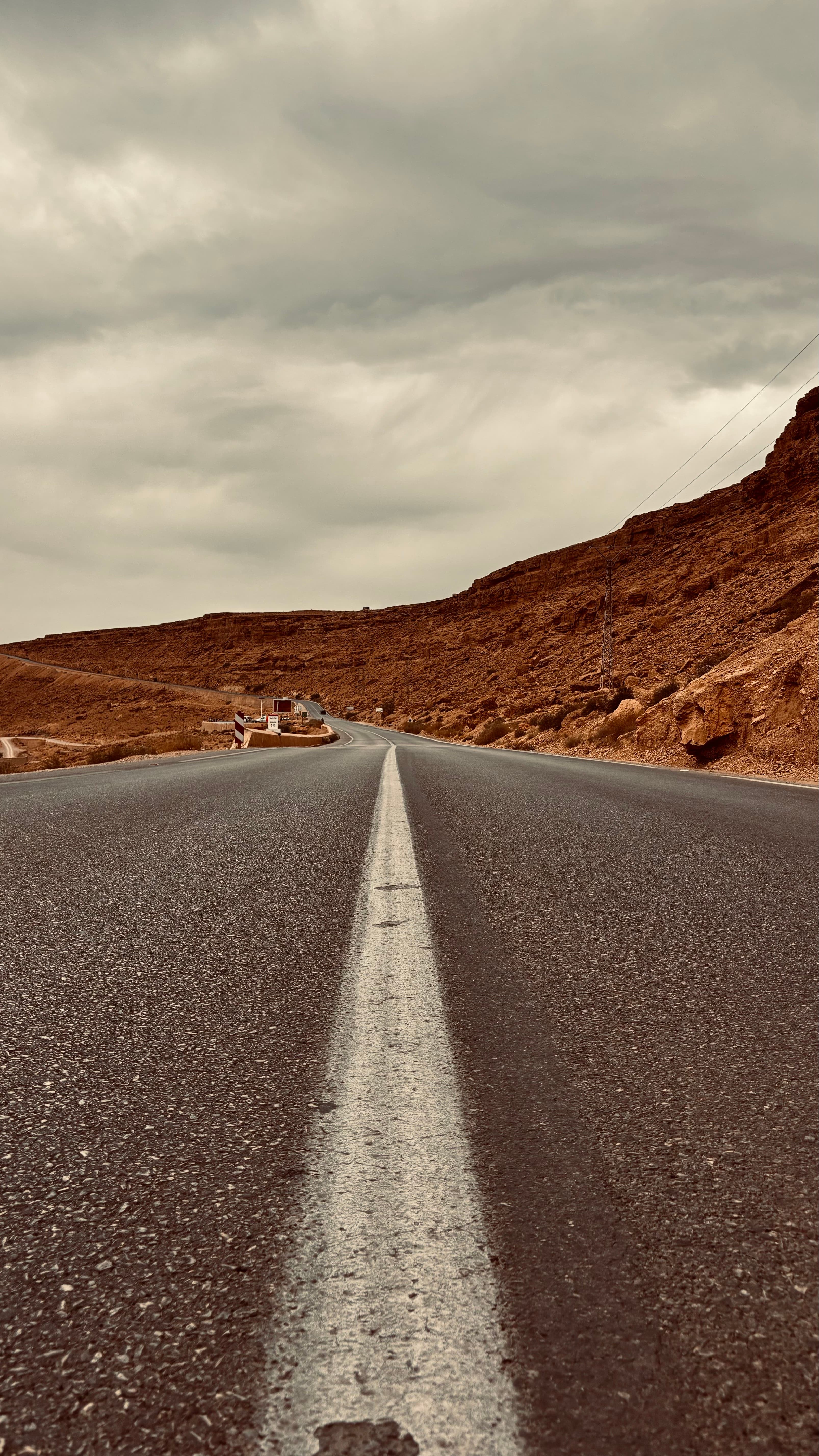 Open Moroccan road leading toward a mountain pass